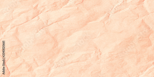 Foto Soft peach crumpled paper texture background with wrinkles and creases
