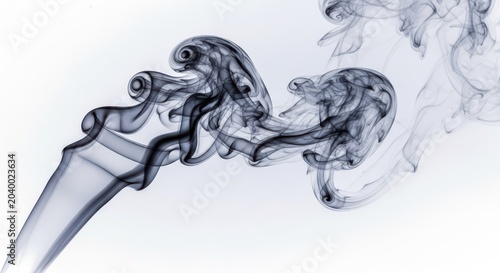 Smoke swirling in air as cigarette burns on white background slowly