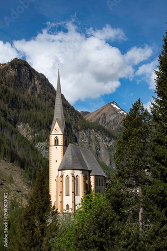Church and village of Heiligenblut on the entrance to the mountain pass over the Grossglockner mountain group in Austria