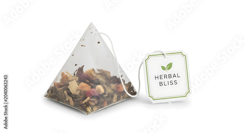Tea bag with label isolated , herbal beverage bag on white background for hot drink preparation and relaxation
