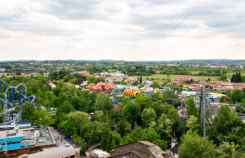 Peschiera Del Garda, Italia - April 30, 2026: Aerial view of Gardaland amusement park featuring colorful attractions, roller coasters, and lush greenery in Italy's scenic landscape