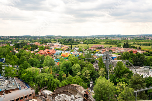Peschiera Del Garda, Italia - April 30, 2026: Aerial view of Gardaland Park amusement rides and attractions surrounded by lush greenery in Italy's scenic landscape