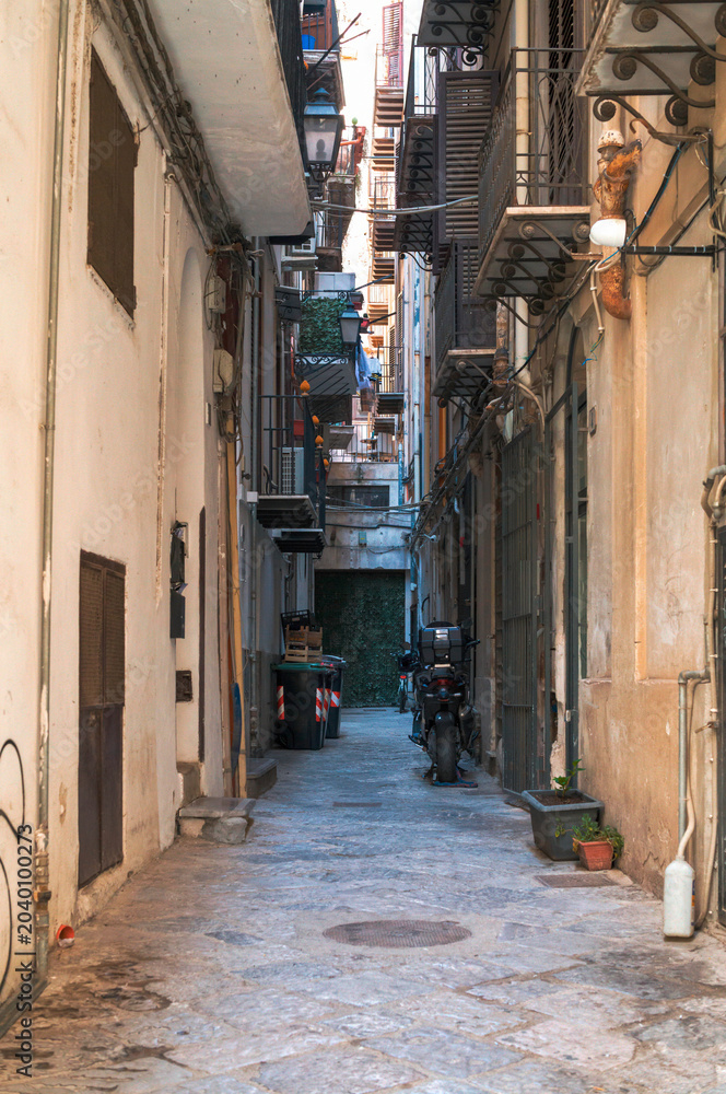 Fototapeta premium Life in a narrow stone alley.