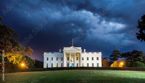 white house at night with stormy skies