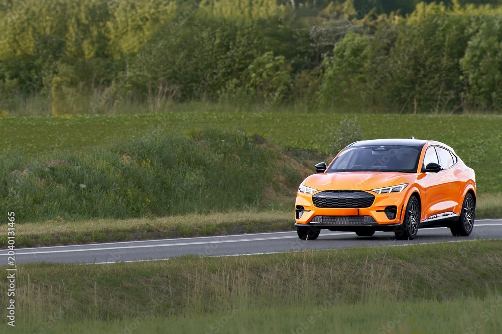 Fototapeta premium Premium electric SUV on open European road