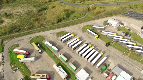 Truck fleet parked at warehouse facility