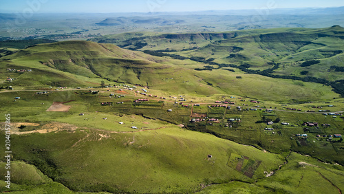 Aerial Mosaic Farmland With Scattered Settlement And Winding Roads, Patchwork Fields And Pasture Contours,