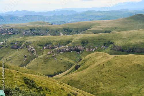 Winding Ravines Drakensberg Deep Folds Cutting Through Grassy Slopes Revealing Textured Geology And Layered
