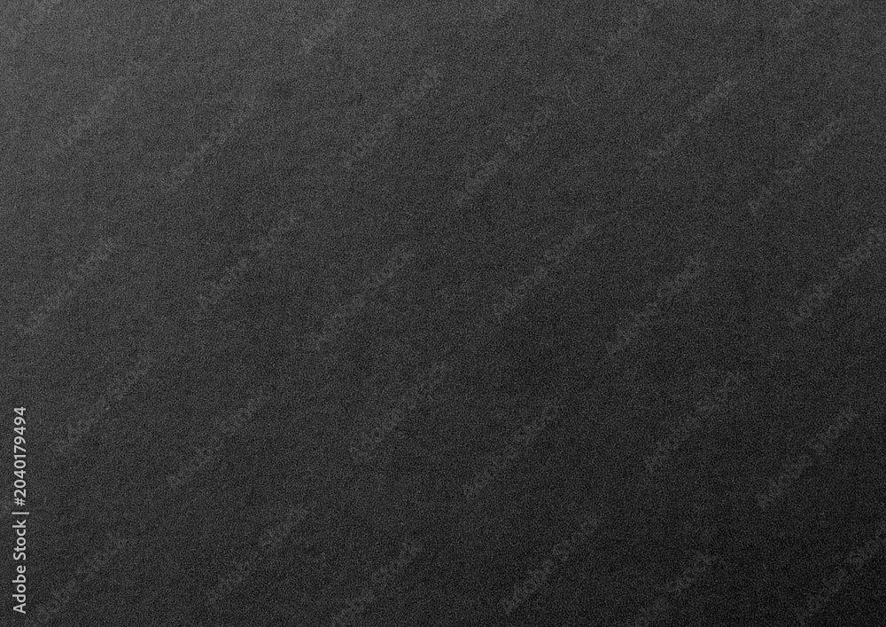 Fototapeta premium Close-up of a textured black surface with a matte finish.