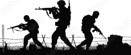 Fotografi Silhouette of Soldiers in Battle: Three soldiers in silhouette charge forward with rifles, navigating barbed wire and debris in a stark depiction of wartime