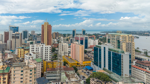 Aerial view of Dar es Salaam showcasing modern buildings, urban development, and a dynamic cityscape.