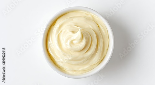 Creamy Mayonnaise in a White Bowl Top View.