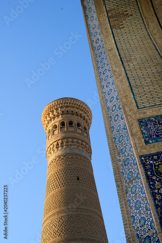 Kalon Minaret and Detail of the Portal of Kalon Mosque in Bukhara, Uzbekistan