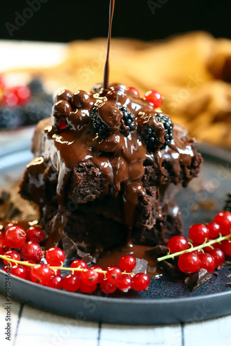 brownies with chocolate and berries