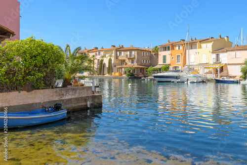 Colorful seaside homes with waterfront docks along the Mediterranean sea at Port Grimaud, France, the 