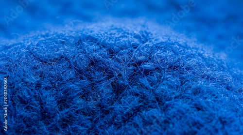 Macro Background of Vibrant Royal Blue Soft Woolen Fabric Texture Showing Intricate Fuzzy Fibers and Textile Detail for Fashion Design