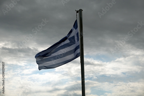 greek flag against a cloudy sky
