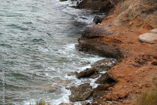 rocky seashore and clear water