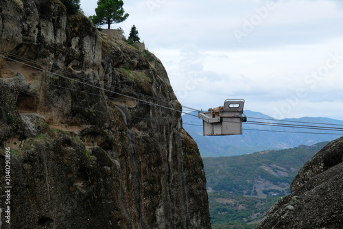 a cart carrying firewood ascending the cable car, Meteora