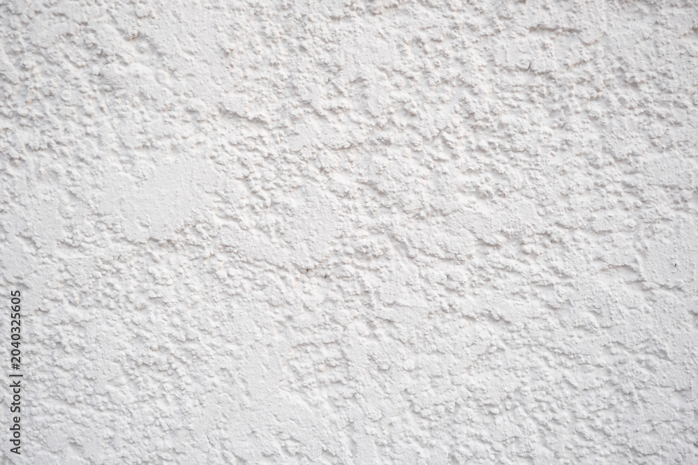 Fototapeta premium White plaster wall with rough texture