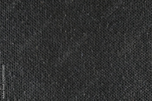Close up texture of black knitted fabric material background macro