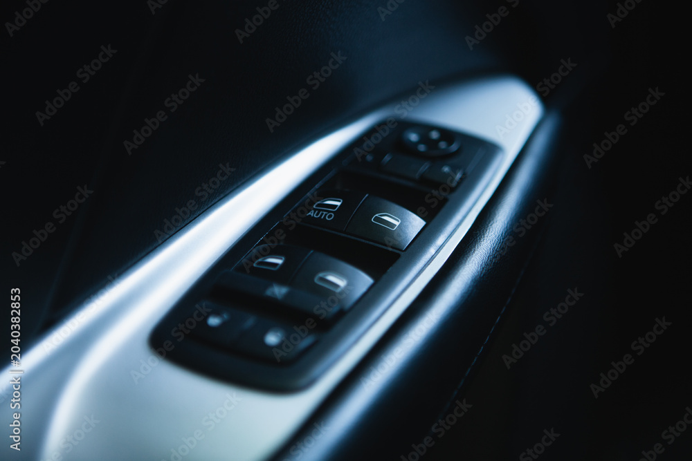 Obraz premium Close up of a door handle in a modern car. Selective focus.