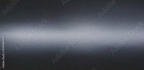 Fotografie Minimalist dark grey gradient featuring a central horizontal bright light streak