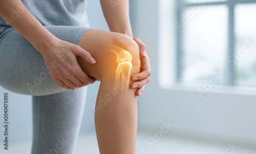 Woman Hold Knee with Highlighted Bone Showing Pain and Discomfort