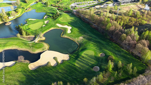 Schilderij op canvas Green golf field with lakes and water features