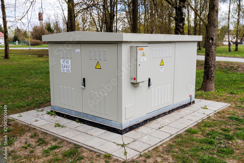 Quadro su tela Outdoor electrical transformer substation enclosure in park