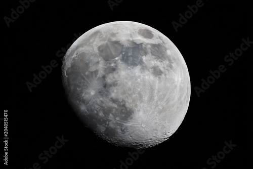 Full moon close-up on black background.