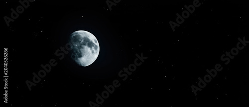 Banner with the moon on a black background, copy space
