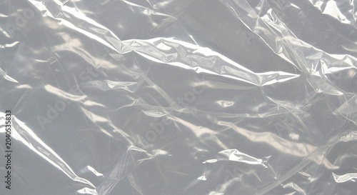 Crumpled Transparent Plastic Sheet Texture with Reflective Highlights