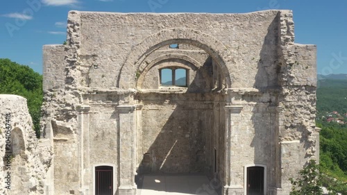 Drone zoom in through the gate of ruins of old cathedral in Kastav, Croatia