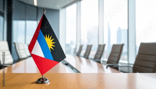 Antigua and Barbuda with Angola flags unite on polished table, radiating diplomacy, resilience, and solidarity; a vivid emblem of national identity, alliance, and transformation.