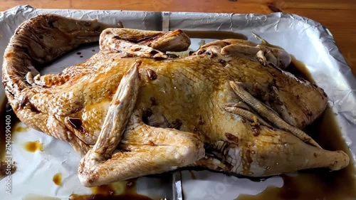 Brushing sauce on baked duck, indoor Chiangmai Thailand.