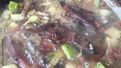 Boiling roasted duck with wax gourd in pot, indoor Chiangmai Thailand.