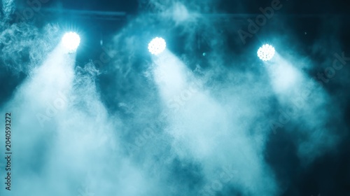 Stage with blue lighting, smoky atmosphere and spotlights