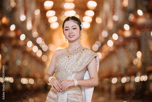Traditional Thai Costume Displayed by Young Woman in Elegant Setting