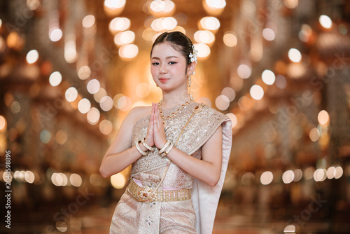Traditional Thai Costume with Model in Elegant Pose at Venue