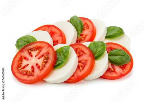 Fresh tomato mozzarella salad with cucumber and basil on a white plate, healthy Italian vegetarian appetizer with fresh vegetables and cheese