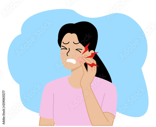 woman with a pained expression holding her aching cheek suggesting a possible toothache