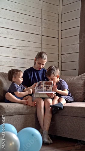Guiding family with stories. Family heritage cultivated through affectionate stories and cozy surroundings. Sister provides mentorship to family through narratives and inviting home atmosphere