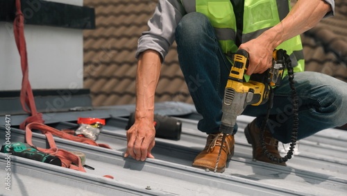 Konstfotografi Close Up of Roofer Using Power Drill for Metal Roof Repair and Maintenance on Re