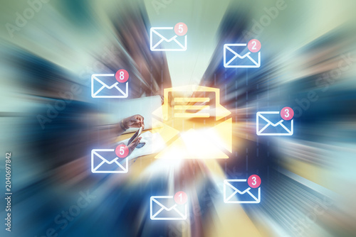 Many messages appear on a digital background while people work on computers in an office during the day