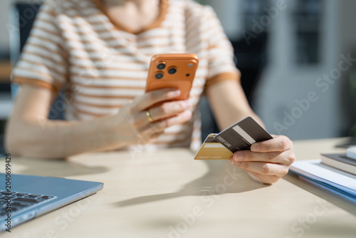 Tableau sur toile woman use credit cards to conduct financial transactions through phones, tablet, and laptop