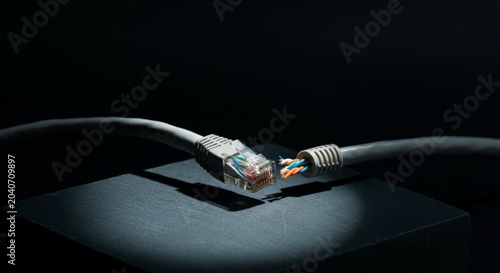 Isometric 45 degree angle studio view cut CAT6 ethernet network.
