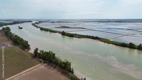 Cargo ship navigating Guadalquivir river in Andalusia
