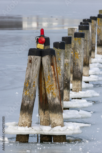 Old wooden pier on frozen Baltic Sea, Rügen, Sassnitz
