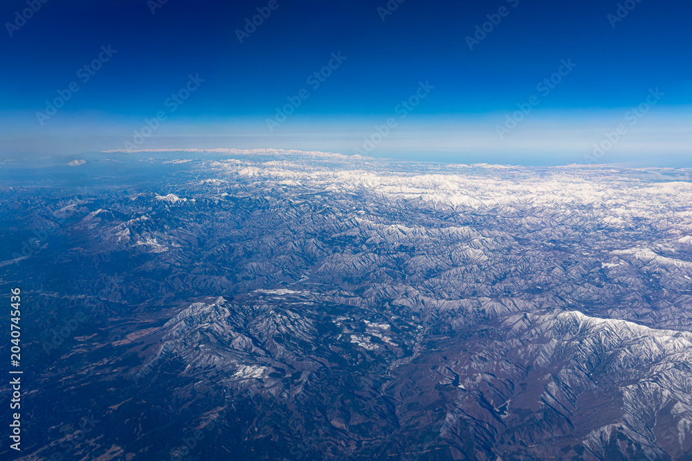 Fototapeta premium aerial view of white snow mountains